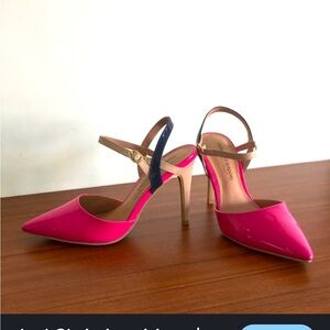 Featuring a patent PU material with a beige ankle strap and black skinny heel
